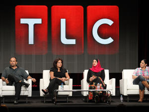 Cast members on a panel hosted by TLC. 