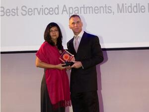 Seema Pande, Area Director of Sales & Marketing, receiving the award on behalf of The Address