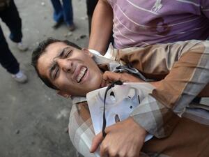 The wounded carried away from Tahrir after the clashes on Friday