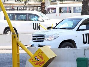 UN inspectors are seen arriving at the hotel in Damascus on August 26, 2013, following their return from an inspection of a suspected chemical weapons attack in Moadamiyet al-Sham. (AFP)