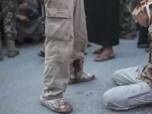 One of the men executed by Syrian rebels in a location outside of Aleppo. (Image: Youtube screenshot)