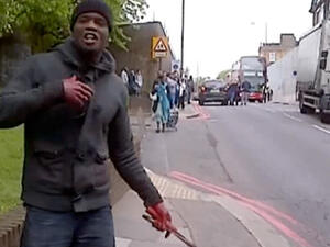 A screen grab of one of the suspects wielding a knife after beheading a man in London on Wednesday. 