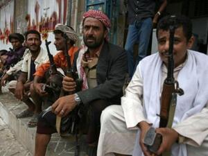 Armed Yemeni men wait for what will happen next in Al Dhale.