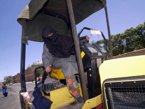 How will their non-too pleased male counterparts react to lady drivers sweeping the Kingdom? Will they urge the Kingdom's
men to beat their wives back to the passenger seat where they belong? In Afghanistan (shown above) women started driving
for practical work reasons after Taliban retreat.