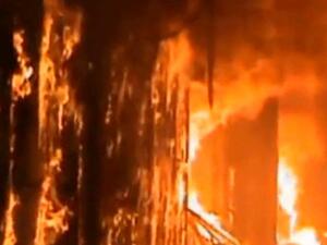 The historical souk in Aleppo burns and the people are in disbelief.