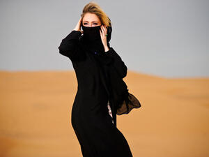 Women can wear anything they like underneath their Abayas. (Image: Shutterstock)