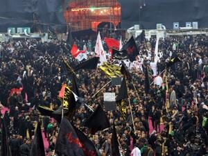 Shiite pilgrims gather in Karbala Tuesday to commemorate the anniversary Imam Hussein's death (Ali al-Saadi/AFP)