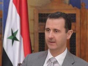 Syrian President Bashar Assad speaks to a reporter.