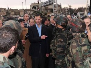 الرئيس السوري بشار الاسد خلال زيارته لبابا عمرو في حمص