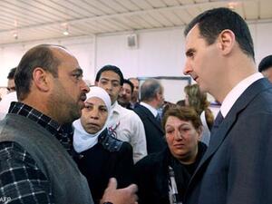 Syrian President Assad makes a rare public appearance at an electrical plant in Damascus. (image AFP/Uprooted Palestinians)