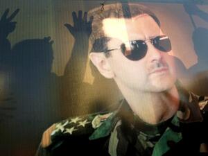 Supporters of Syrian President Bashar Assad rally during a demonstration against a possible US military strike on Syria in the Lebanese city of Sidon. (AFP)