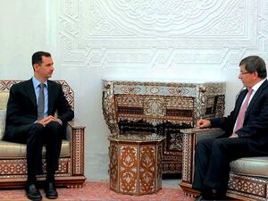 الاسد يبلغ اوغلو اصراره على محاربة "الارهابيين" 