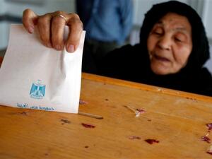 An Egyptian woman casts her vote at a polling station. 