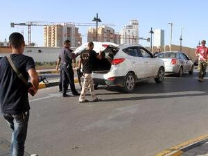Local militias have set up their own checkpoints throughout the country as a way to maintain power over territory since the oust of Gaddafi in 2011 (File Archive/AFP)