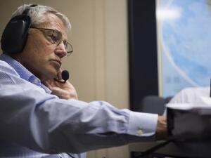 US Secretary of Defense Chuck Hagel speaks with French Minister of Defense Jean-Yves Le Drian from his plane on Tuesday. (AFP)