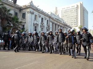 Egypt riot police officials approach protestors outside of a court in Alexandria. The new military trial article that allows civilians to be tried in front of a military court has elicited criticism and protest from many Egyptians as well as regional and international human rights groups (AFP)