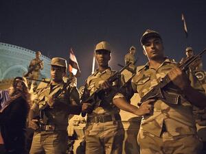 Soldiers stand guard outside Egypt's presidential palace on July 19. (AFP / KHALED DESOUKI)