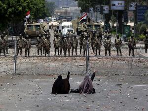 Egyptian women face off with police on July 8, 2013. (source: AFP / MAHMUD HAMS)