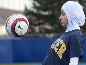 When sports federations ban women's dress,  you'd hope it was in the name of aero-dynamics. FIFA and the international basketball federation have come down on devout girls' dress,  including or rather excluding, veil and 'vests'.