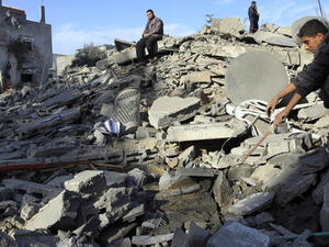 Israeli airstrikes regularly damage Palestinian property severely. Here, Palestinians look at the wreckage of their homes in the Gaza town of Rafah in late 2012. (AFP/File)
