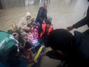 Rescue services have been evacuating thousands of Gazans from their homes due to heavy flooding that has left many homes underwater (Mahmud Hams/AFP)
