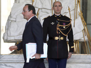 French President Francois Hollande leaves after the weekly cabinet meeting. (Image credit: AFP)