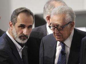 Lakhdar Brahimi with Syrian opposition leader Moaz Al-Khatib at the Arab League Doha summit in March