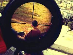 Mor Ostrovski, an Israeli soldier, posted this picture of a child in crosshairs of his rifle on his Instagram account. (Photo courtesy of electronicintifada.net)
