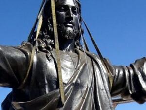 Workers put the finishing touches on erecting a statue of Jesus atop the Cherubim mountain in Syria.