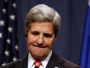 US Secretary of State John Kerry grimaces during a press conference in Geneva on September 14, 2013 after holding talks with his Russian counterpart on Syria's chemical weapons. Washington and Moscow have agreed a deal to eliminate Syria's chemical weapons, Kerry said after talks with Russian Foreign Minister Sergei Lavrov. Kerry said Sunday that the US is still prepared to use force against Syria if diplomacy fails. (AFP)