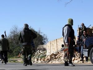 Libyan militant groups clashed in Tripoli's western suburbs leaving at least five dead and 20 injured (AFP)