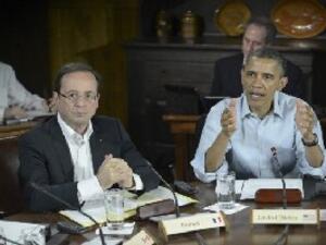 US President Barack Obama (R) and French President Francois Hollande attend a G8 session on May 19, 2012 in Maryland (AFP/File)