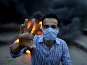 An Egyptian man shot his neighbour near Cairo after his daughter made a pro-Morsi sign. (AFP/File)