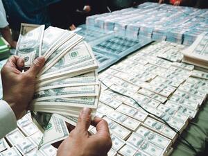 When you've got surplus money to 'throw about' you might well shower it down on entertainers at a party...