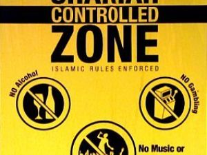 Zoning: a way to have religious law circumscribed to a region of an otherwise non-practicing nation under state rule. The posters warn passers that they are entering a zone under Islamic rules, such as 'no alcohol' or 'no porn or prostitution'.

