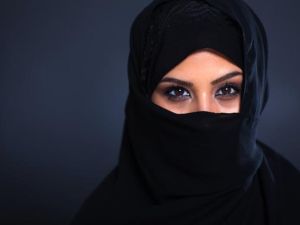Violence is on the rise against women and children in Saudi Arabia. (Veiled face/ michaeljung/Shutterstock)