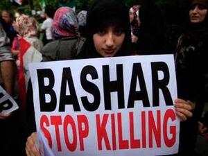 Is America really only limited to signs and banners to stop Bashar Assad?