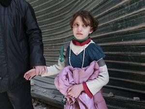A poor, young Syrian girl is in tears as she is escorted off by her new "husband". (image courtesy of takepart.com)