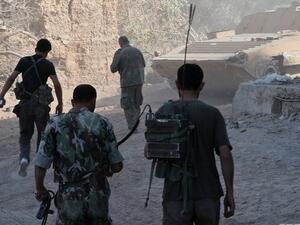 Syrian army soldiers are seen deployed in the Jobar neighbourhood of Damascus on August 24, 2013. (AFP)