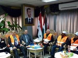 صورة بثها وكالة سانا تظهر المراقبين العرب خلال لقائهم مسؤولين سوريين في طرطوس 
