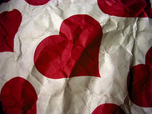 Valentine's Day or Single Awareness Day? Depends on what side of the crumpled wrapping paper you're looking at.