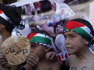 Dozens of Yarmouk residents are dying from hunger - according to activists, they've been surviving on a diet of stale vegetables, herbs, powdered tomato paste, animal feed and cooking spices dissolved in water. (AFP/File)