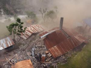 Damaged houses are seen from an Indian Army helicopter at Lapu in the Nepalese area of Gorkha on April 28, 2015. (AFP/Sajjad Hussain)