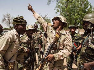 Nigerian troops celebrate after taking over the town of Bama from Boko Haram. (AFP/Nicole Sobecki)