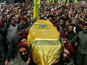 Hezbollah supporters rally during a funeral for one of their members in Beirut. (AFP/File)