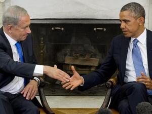 US President Barack Obama (R) and Israeli Prime Minister Benjamin Netanyahu shake hands during a meeting in the Oval Office of the White House. (Image Credit: AFP)
