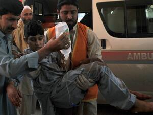 Pakistani volunteers move a victim injured in a suicide bombing to a hospital in Peshawar on March 7, 2016, after an attack on a court complex in the town of Shabqadar. (AFP/Hasham Ahmed)