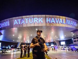 A policeman on high alert at the Istanbul Ataturk Airport after the June 28 attack (AFP)