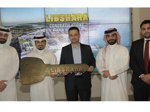 The winner with Mr. Subah Al Zayani and representatives from KFH-Bahrain and Marassi Al Bahrain