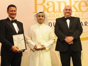 Abdulla Al-Najran Al-Tuwaijri, NBK’s Deputy Group General Manager, receives the award from Banker Middle East